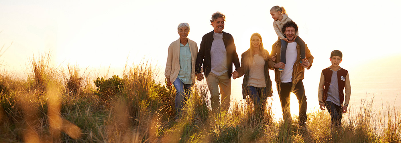 Family outdoors with grandparents enjoying day without worry of final planning